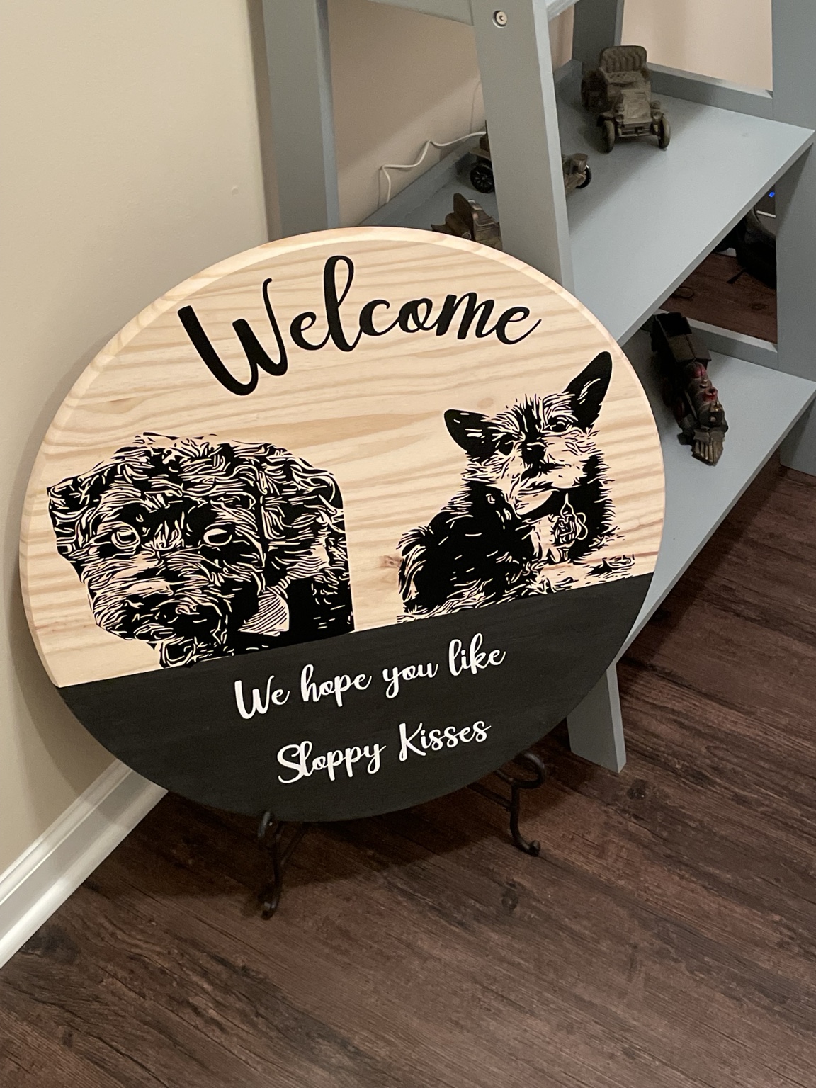 Custom wooden welcome sign featuring Tucker and Ike: We hope you like sloppy kisses